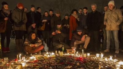 Pens are thrown on the ground as people hold a vigil at the Place de la Republique (Republic Square) for victims of the terrorist attack, on January 7, 2015 in Paris