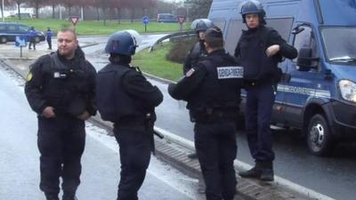 Police outside the printing business