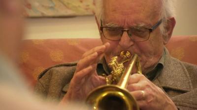 A man playing a trumpet