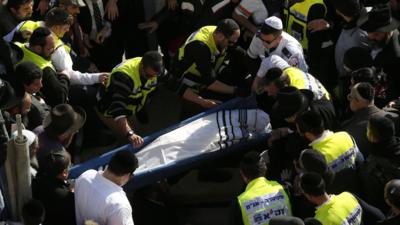 Mourners carry the body of Yoav Hattab at a Jerusalem cemetery