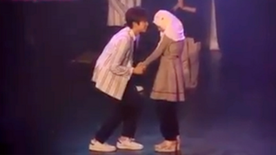 K-Pop star holds hand of young Muslim girl