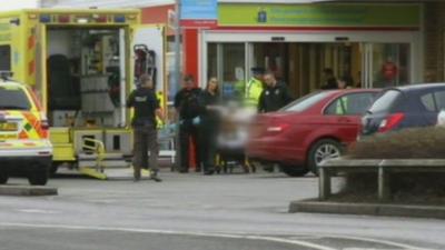 Victim taken to ambulance at Mold Tesco store