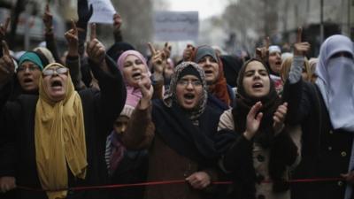 Protesters from the Islamic Action Front and others chant slogans during a protest against satirical French weekly newspaper Charlie Hebdo