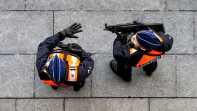 Policemen patrol near the courthouse on Bolivar Square in Antwerp