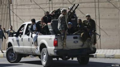 Houthi fighters on truck outside presidential palace in Sanaa