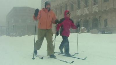 Skiers on Boston street