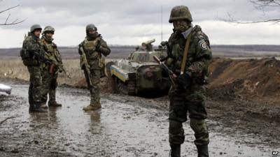 Ukrainian government army soldiers at a check-point near the village of Debaltseve, Donetsk region, eastern Ukraine Wednesday, Dec 24, 2014