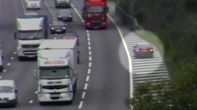 Car driving against the traffic on a motorway