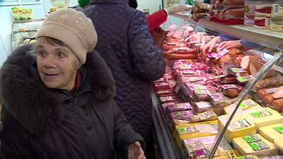 Older lady at meat counter