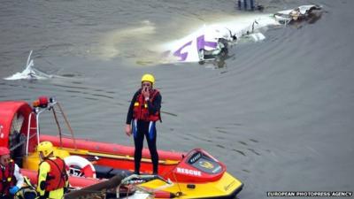 Rescuers near the plane wreckage