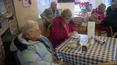 Pensioners having tea