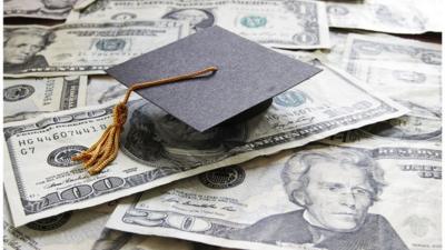 A graduation cap on top of US bank notes