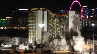 The Clarion hotel and casino is imploded, early Tuesday, Feb. 10, 2015, in Las Vegas.