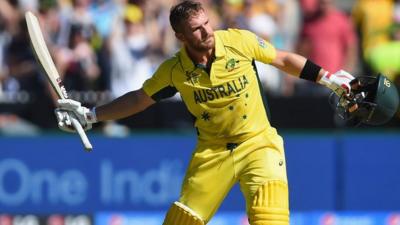 Aaron Finch celebrates after scoring a century of runs