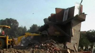 Thirteen people have died after a building collapsed in India's Uttar Pradesh state