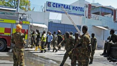 Somali security forces, paramedics and fire fighters outside the Central Hotel in Mogadishu on 20 February 2015