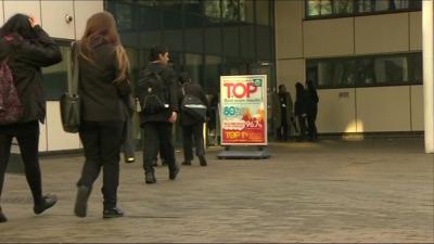 Pupils arrive at Bethnal Green Academy in east London on Monday