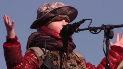 A child in military clothing