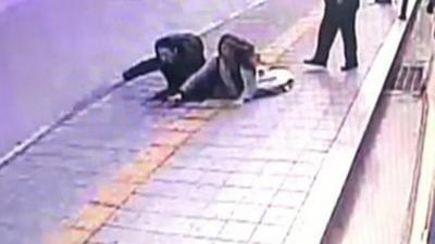 The couple falling into the sinkhole