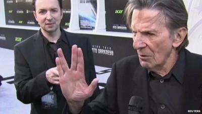 Leonard Nimoy at red carpet event making his famous 'Mr Spock' salute