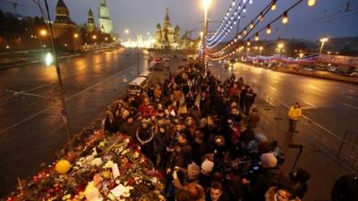 People gather at the site where Boris Nemtsov was recently murdered, in central Moscow