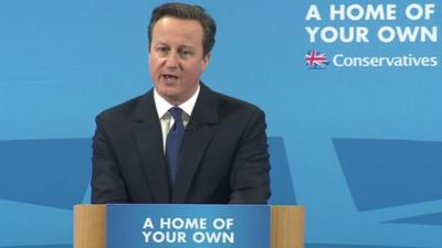 David Cameron speaks during a visit to a building site in Essex