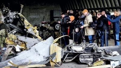 Friends and family of the victims of the MH17 plane crash take a look at the wreckage on 3 March, 2015