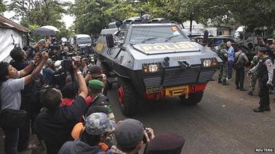 Police vehicle believed to be carrying two Australian prisoners, arrives at the port to take a ferry to the prison island of Nusa Kambangan