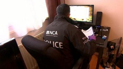 A police officer on a cybercrime raid