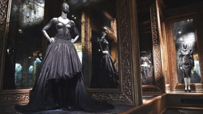 Romantic gothic designs by British fashion designer Alexander McQueen on display at the V&A Savage Beauty exhibition