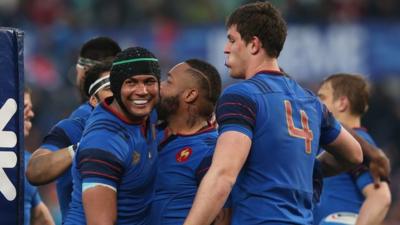 French players surround Mathieu Bastareaud to congratulate him on his late try in Rome