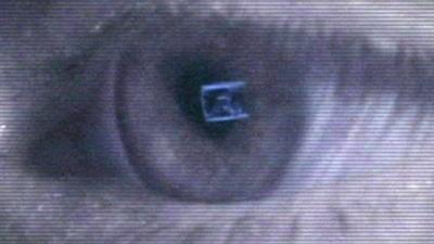 An eye looking at a computer