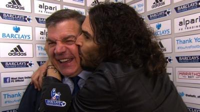 Russell Brand kisses Sam Allardyce