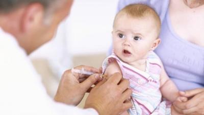 A baby receiving an injection