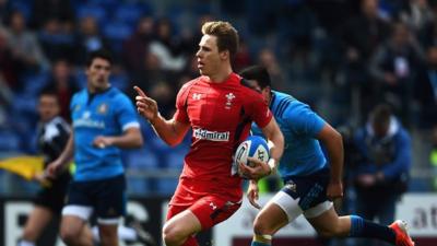 Winger Liam Williams crosses for one of Wales' many second half tries