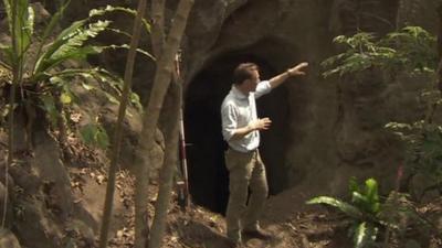 Rupert Wingfield-Hayes pointing at tunnel