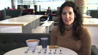 Dr Radha with spoons full of sugar