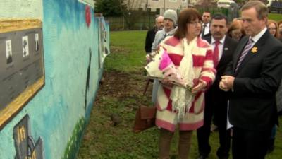 Enda Kenny laid flowers at the site in Ballymurphy where the shooting took place in August 1971