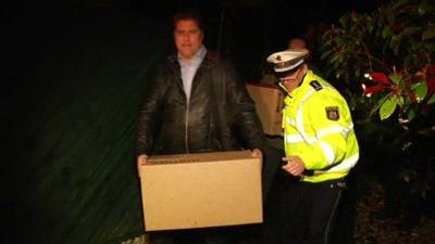 Documents being removed from a property