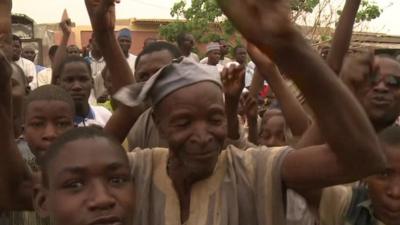 Nigerians from Daura celebrate Buhari's presidential win.