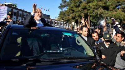 Iranian Foreign Minister Mohammad Javad Zarif pays respect to his well wishers upon arrival at in Tehran