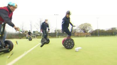 People playing segway polo