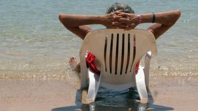 Person on holiday on beach