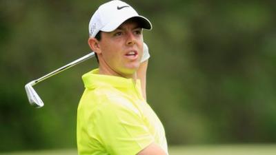 McIlroy watches his second shot on the second hole on Sunday