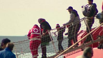 Rescued migrants including children