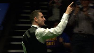 Defending world champion Mark Selby celebrates victory