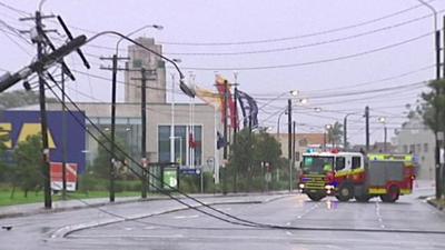 Overturned power lines and a fire engine