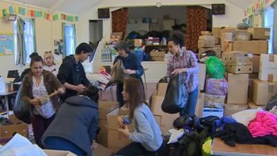 Volunteers pack donations for Nepal