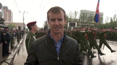 BBC reporter Tom Burridge at a Victory Day parade organised by pro-Russian rebels in the Ukrainian city of Donetsk