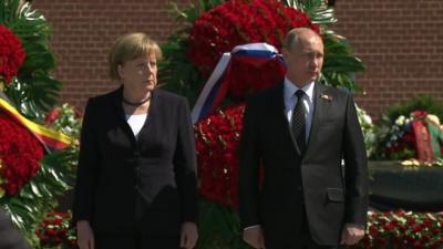 German Chancellor Angela Merkel standing next to Russia's President Vladimir Putin